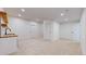 Spacious basement with light carpet, modern wet bar, and recessed lighting at 3565 New Haven Cir, Castle Rock, CO 80109