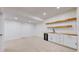 Spacious basement with light carpet, modern wet bar, and recessed lighting at 3565 New Haven Cir, Castle Rock, CO 80109