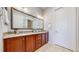 Double vanity bathroom with tile floor and backsplash at 3565 New Haven Cir, Castle Rock, CO 80109