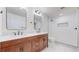 Bathroom featuring double sink vanity, and a modern shower with white subway tile at 3565 New Haven Cir, Castle Rock, CO 80109