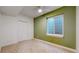 Bedroom featuring a green accent wall, bright window well and ceiling fan at 3565 New Haven Cir, Castle Rock, CO 80109