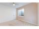 Bedroom with a window, ceiling fan, and neutral-toned walls, creating a cozy and comfortable space at 3565 New Haven Cir, Castle Rock, CO 80109