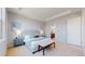 Primary bedroom featuring a large window, tray ceiling, and a king-sized bed at 3565 New Haven Cir, Castle Rock, CO 80109