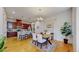 Open concept dining area with hardwood floors, seamlessly connecting to the kitchen and living spaces at 3565 New Haven Cir, Castle Rock, CO 80109