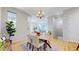 Bright dining area showcasing an elegant chandelier and views into the living room at 3565 New Haven Cir, Castle Rock, CO 80109
