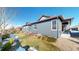 Rear exterior view of a home with a lawn and new landscaping at 3565 New Haven Cir, Castle Rock, CO 80109