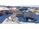Aerial view of a home with stone accents, a well-manicured lawn, and mature landscaping at 3565 New Haven Cir, Castle Rock, CO 80109