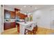 Stylish kitchen featuring a central island with seating, stainless steel appliances, and ample cabinet space at 3565 New Haven Cir, Castle Rock, CO 80109