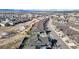 Aerial view of neighborhood shows landscape, street layout, and housing density at 3565 New Haven Cir, Castle Rock, CO 80109