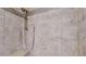 A tiled shower featuring a hand-held shower head with a bench, and decorative tile accents at 3565 New Haven Cir, Castle Rock, CO 80109