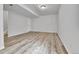 Unfinished basement with vinyl floors, neutral walls, and utility access at 22974 E Dorado Dr, Aurora, CO 80015