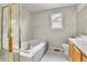 Bathroom featuring tub, shower and vanity at 22974 E Dorado Dr, Aurora, CO 80015