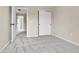 Neutral bedroom featuring soft gray carpet, closet, and doorways to other parts of the home at 22974 E Dorado Dr, Aurora, CO 80015