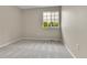 This cozy bedroom has neutral walls and carpet with a large window offering natural light at 22974 E Dorado Dr, Aurora, CO 80015