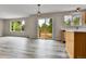 Bright and airy dining area featuring wood floors, access to the backyard, and ample natural light at 22974 E Dorado Dr, Aurora, CO 80015