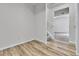 This hallway features wood-look floors and leads to the stairway and other rooms at 22974 E Dorado Dr, Aurora, CO 80015