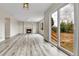 Spacious living room with a fireplace, wood flooring, and sliding glass doors to the backyard at 22974 E Dorado Dr, Aurora, CO 80015