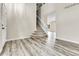 Inviting living room with staircase, wood floors, and neutral paint, perfect for modern living at 22974 E Dorado Dr, Aurora, CO 80015