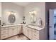 Bathroom features dual vanities with granite countertops and stylish mirrors at 15855 Wild Horse Dr, Broomfield, CO 80023