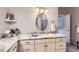 Bathroom boasts granite counters, modern lighting, oval mirror, and neutral color palette at 15855 Wild Horse Dr, Broomfield, CO 80023