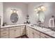 Bathroom features dual vanities with granite countertops, modern fixtures and lighting at 15855 Wild Horse Dr, Broomfield, CO 80023