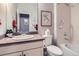 Cozy bathroom featuring a neutral color scheme, framed artwork, and combined tub and shower at 15855 Wild Horse Dr, Broomfield, CO 80023