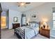 Serene bedroom with soft carpet, ceiling fan, and ample natural light at 15855 Wild Horse Dr, Broomfield, CO 80023