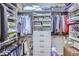 Walk-in closet with built-in shelving, drawers, hanging rods, and ample storage space at 15855 Wild Horse Dr, Broomfield, CO 80023