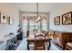 Elegant dining room with a large table, natural light, and charming decor at 15855 Wild Horse Dr, Broomfield, CO 80023