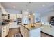 A spacious kitchen features a center island with a sink and breakfast bar at 15855 Wild Horse Dr, Broomfield, CO 80023