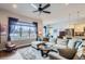 Inviting living room with hardwood floors, a comfortable sofa, and large windows at 15855 Wild Horse Dr, Broomfield, CO 80023