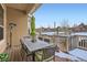 Covered patio features an outdoor dining set, green umbrellas, and heaters for the cooler months at 15855 Wild Horse Dr, Broomfield, CO 80023
