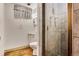 Compact bathroom featuring a tiled shower and a classic vanity at 7839 Florado St, Denver, CO 80221