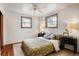Comfortable bedroom with hardwood floors, neutral walls, and a ceiling fan at 7839 Florado St, Denver, CO 80221