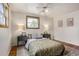 Bright bedroom with hardwood floors, a ceiling fan, and decorative accents at 7839 Florado St, Denver, CO 80221