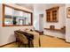 Cozy dining area with table, chairs, and a large mirror, for a well-lit experience at 7839 Florado St, Denver, CO 80221