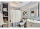 Bright bathroom with a stylish vanity, modern fixtures, and organized shelving at 1629 Valentia St, Denver, CO 80220