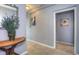 Hallway showcasing a wooden console table, tasteful wall art, and neutral carpet at 1629 Valentia St, Denver, CO 80220