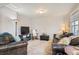 Comfortable living room with leather seating, accent rugs, and ambient lighting at 1629 Valentia St, Denver, CO 80220