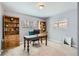 Cozy home office with natural light, built-in bookshelves, and a comfortable workspace at 1629 Valentia St, Denver, CO 80220