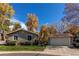 Charming single-story home featuring well-maintained landscaping and a detached two-car garage at 9310 Pierce St, Broomfield, CO 80021