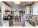 Bright kitchen with white cabinets, stainless steel appliances, and open view to dining area at 9310 Pierce St, Broomfield, CO 80021