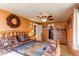 Cozy main bedroom features log bed frame, Southwest style bedding, ceiling fan, and rustic decor at 9310 Pierce St, Broomfield, CO 80021