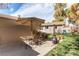 An outdoor patio with dining furniture, potted plants, and a fire pit at 9310 Pierce St, Broomfield, CO 80021