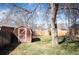 Backyard view highlighting the lawn, mature tree, and wooden shed at 2345 S Williams St, Denver, CO 80210