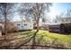 Spacious backyard featuring a shed, mature trees, and partial fencing at 2345 S Williams St, Denver, CO 80210