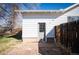 Exterior view showcasing the backyard, including a door and fenced area at 2345 S Williams St, Denver, CO 80210