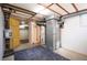 Basement space with exposed ceiling, utility connections, and concrete floor at 2345 S Williams St, Denver, CO 80210