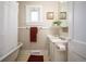 Cozy bathroom featuring a tub, vanity, and a bright window at 2345 S Williams St, Denver, CO 80210