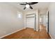 Bedroom with hardwood floors, a large closet, and an open doorway to another room at 2345 S Williams St, Denver, CO 80210